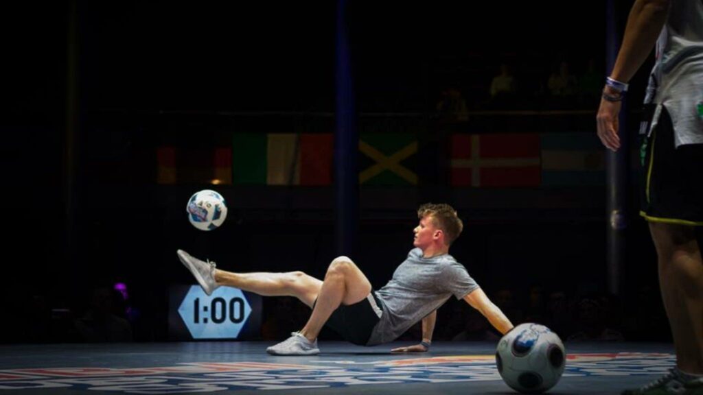 Football trickster does football stunts at show
