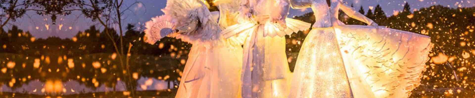 Stilt-Walkers-Wearing-Christmas-LED-Costumes Stilt-Walkers-Wearing-Christmas-LED-Costumes