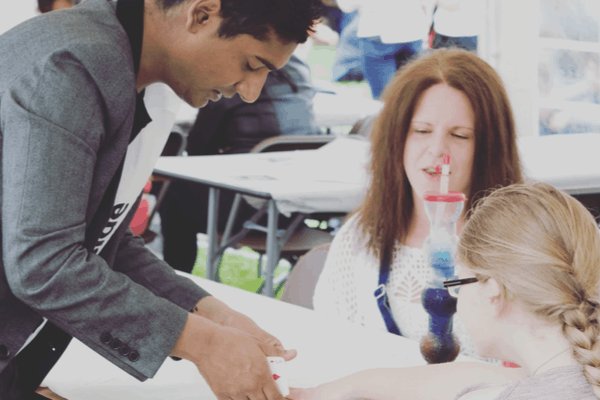 Abz the close-up magician performing at a public event in the UK. Abz the close-up magician performing at a public event in the UK.