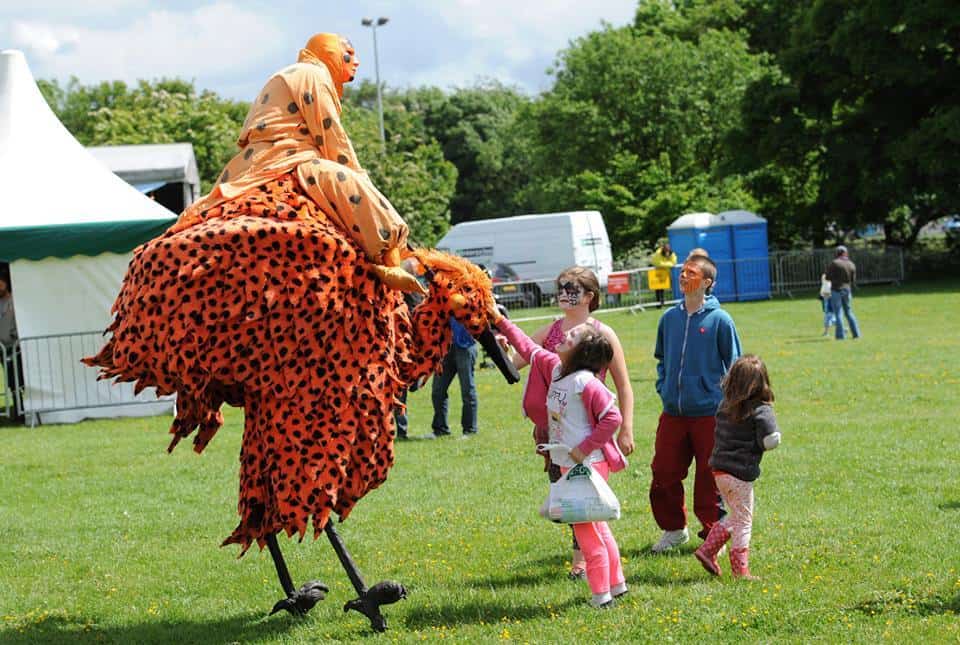 Animal-themed stilt walkers for hire. Book our Tropical Bird Stilt Walkers for family fun days in the UK & London.