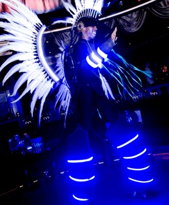 Glow Quetz for hire. Book our sci-fi themed stilt walkers for corporate events in London & the UK.