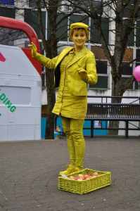 Yellow human statue and poet for hire London and the UK