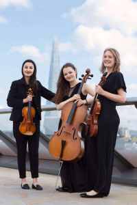 Classically trained corporate & wedding string trio for hire in London. Classical string trio on Millennium Bridge.