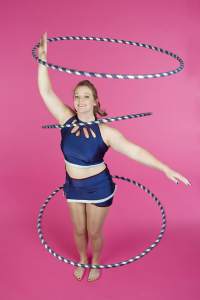 Acrobatic hula hoop dancer for hire. UK-based hula hoop performer for hire for gala dinners & award ceremonies.