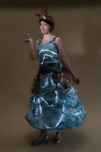 LED ocean-themed performer for hire. Book our Ocean Goddess walkabout performer for children's events in the UK & London.