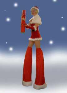 Mrs Clause Stilt Walker for hire. Our Christmas-themed walkabout acts are available to book for shopping centre events, Christmas parades or corporate events in London & the UK
