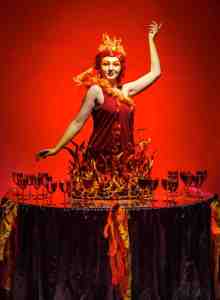 The Fire Fairy Human Table for hire. Our hell-themed human drinks table is available to book for Halloween-themed events, corporate events or private events in London & the UK.