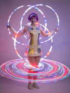 1960's Space Glow Show for hire. Book our LED poi performer for corporate events, product launches or family fun days in London & the UK.