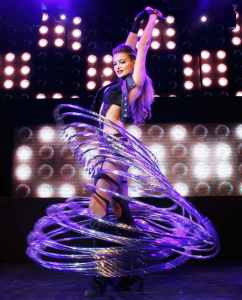 The Astonishing Hula Hooper for hire. Book our hula hoop performer for corporate events, award ceremonies on product launches in London & the UK.