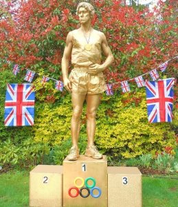 Gold Olympic Living Statue performer available to book for event appearances in London and across the UK.