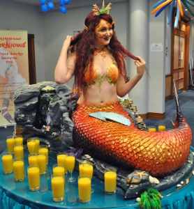 Human Mermaid Table for hire. Book our ocean-themed living table for aquatic-themed events in London & the UK.