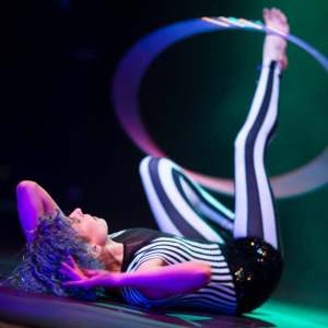 Fire hula hoop performer for hire. Book The Exceptional Hula Hooper for product launches in London & the UK.