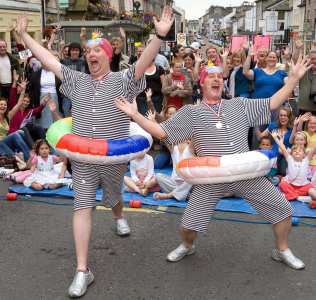 The Calamitous Swimmers for hire. Our comedy walkabout duo is available to book for sports-themed events, shopping centre events or outdoor events in London & the UK.