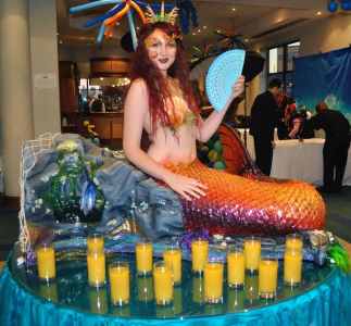 The Human Mermaid Table for hire. Book our living mermaid table for aquatic-themed events in the UK & London.