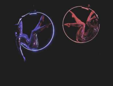 Aerial LED Hoop Performer for hire. Our aerial acts are available to book for gala dinners, weddings or corporate events in the UK & London.