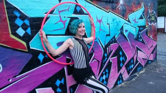 The Exceptional Hula Hooper for hire. Book our poi Hula Hooper for corporate events in the UK & London.
