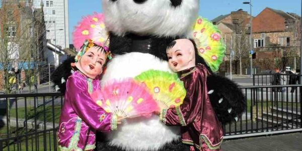 Walkabout-Giant-Panda-Poses-With-China-Doll-Characters