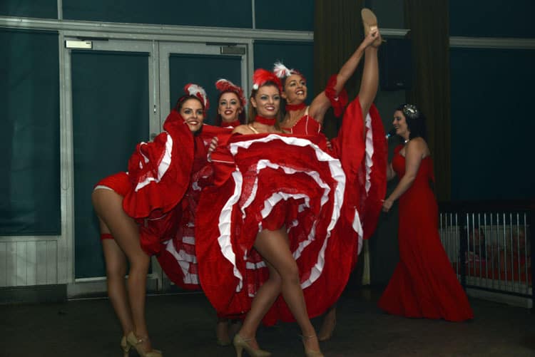Cabaret Style Show Dancers wearing puffy red and white cabaret style clothing.