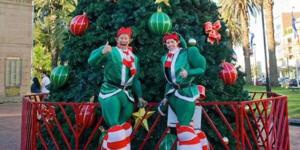 Christmas-Elves-Wearing-Jumping-Stilts