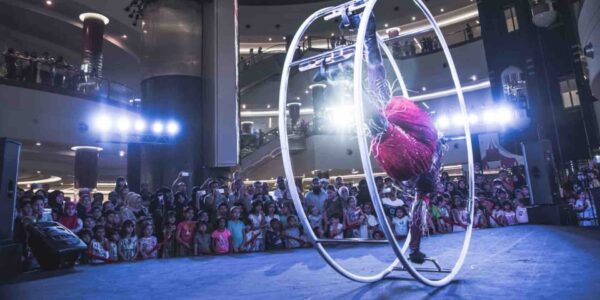 Circus-Entertainers-Performing-For-Large-Crowd
