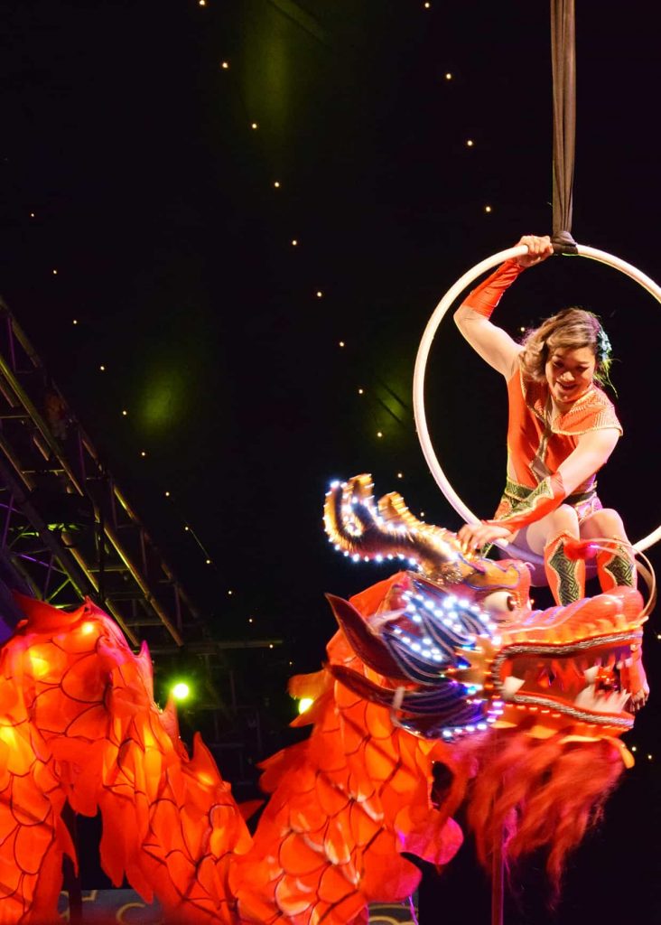 Cirque Shanghai Aerial Hoop Performer on stage at a Chinese New Year Themed Event. Our Chinese Circus Show is available to hire in the UK and Worldwide.