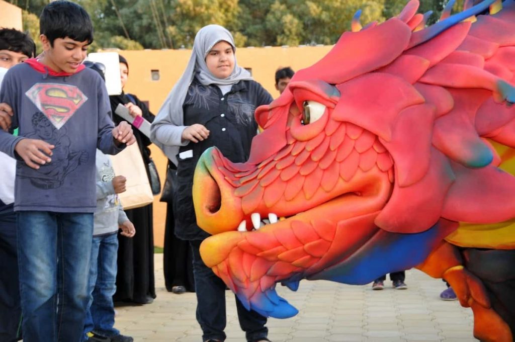 Realistic Red Animatronic Dragon available to book as a show or walkabout performer for events in the UK and Internationally.