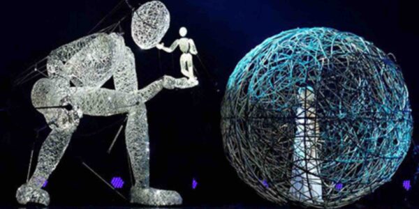 Giant-Puppet-Holds-Smaller-Puppet