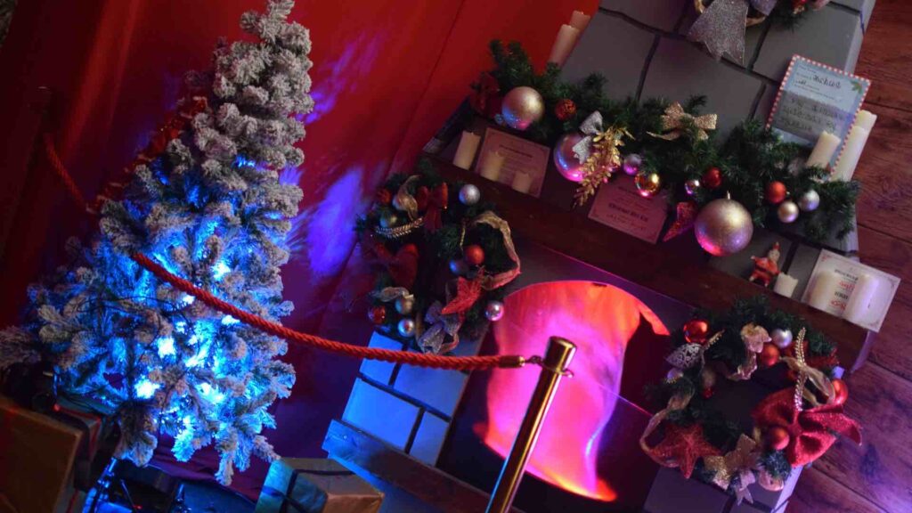 Fireplace and Christmas tree inside grotto