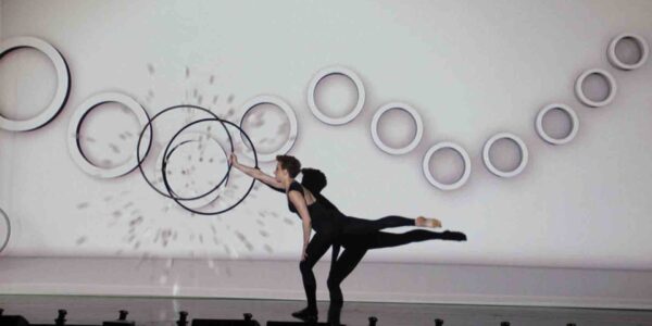 Hula-Hoop-Artist-Performs-Against-Video-Backdrop