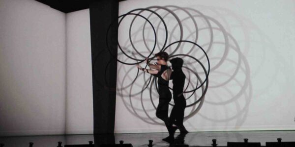 Hula-Hoop-Performers-Create-Shadows