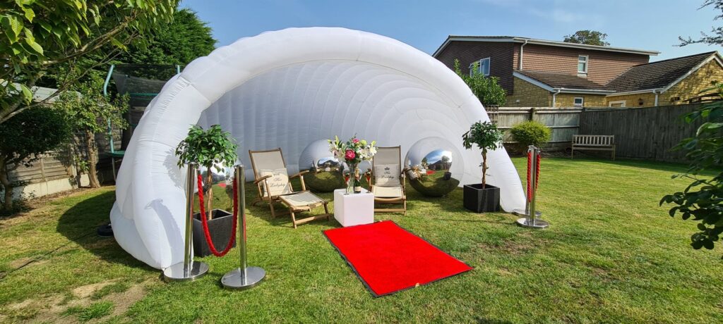 Inflatable Igloo Photobooth with props, seating and more.