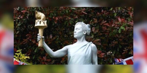Olympic living statues torch bearer.