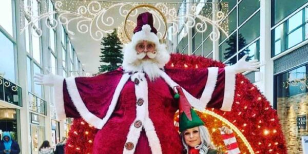 Santa-Stilt-Performer-With-Elf