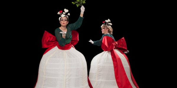 Stilt-Walker-Holding-Mistletoe