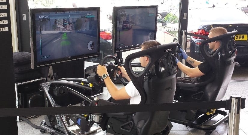 Person using racing F1 simulator.