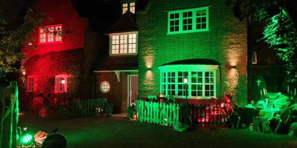 Halloween-House-Dressing-Front-Of-House-Lit-Up-Red-And-Green
