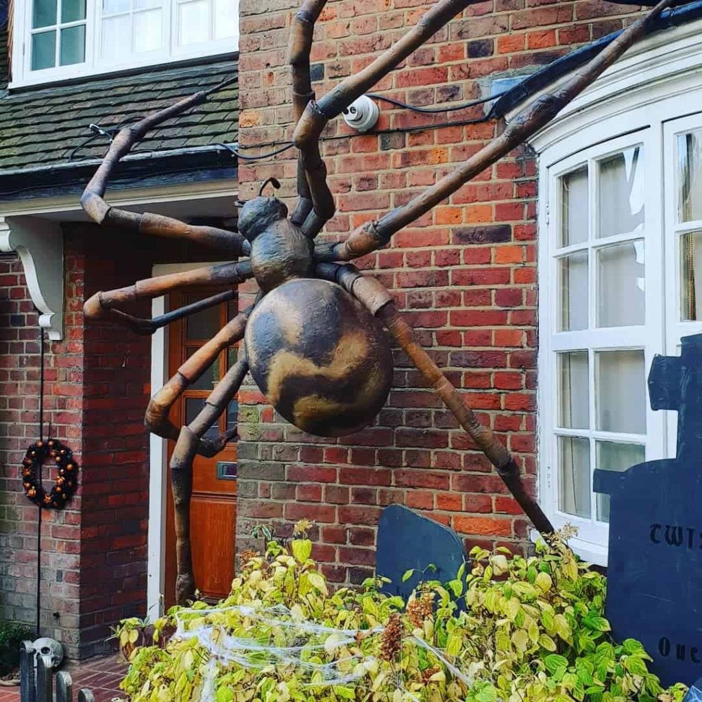 Large Spider Prop hanging on the front of the house for the annual Hampstead Way, London Halloween Street Party.