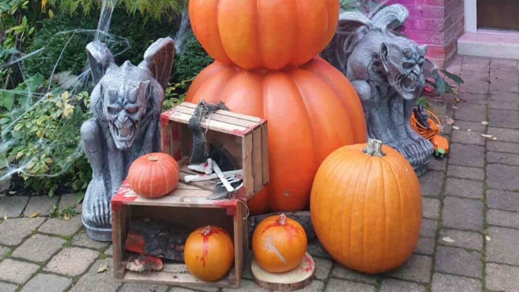 Close-up of pumpkins and bespoke props we used to decorate our client's driveway and front of house.