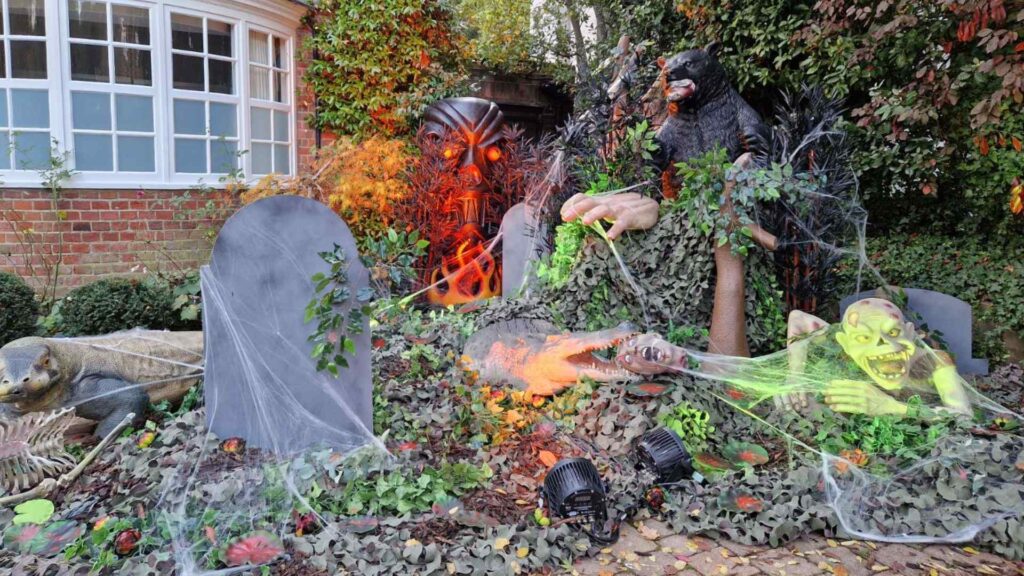 Zombie graveyard set design we designed and built for our client's home for Halloween.