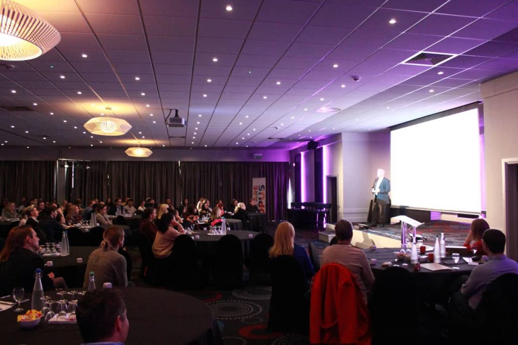Guest Speaker on stage at Opus Energy Conference.