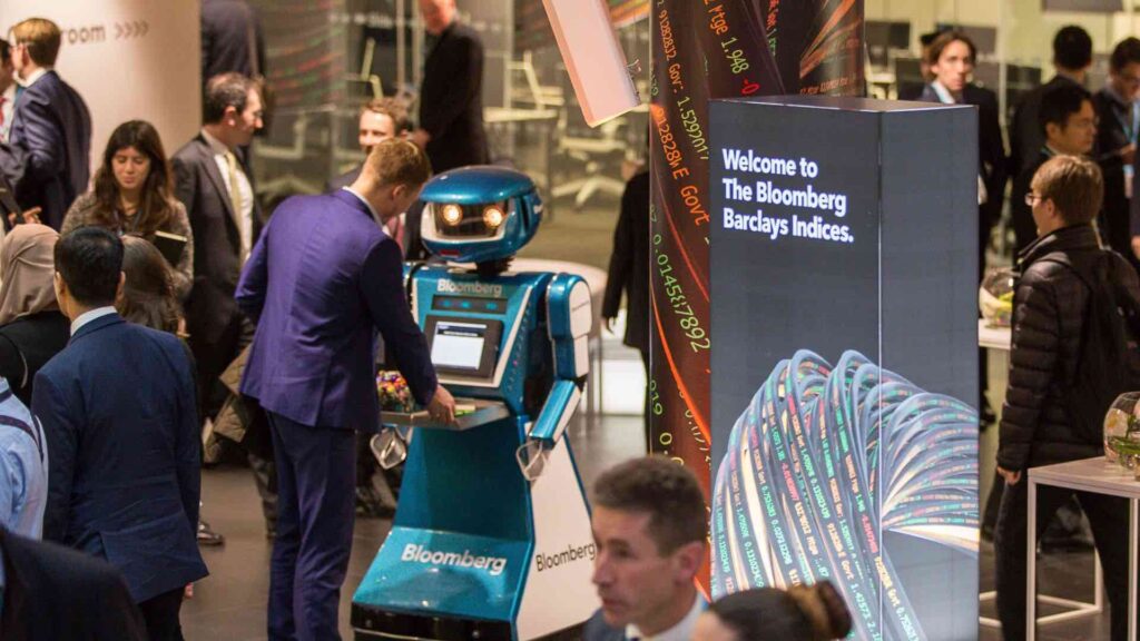 Guests at exhibition event interacting with robot entertainer