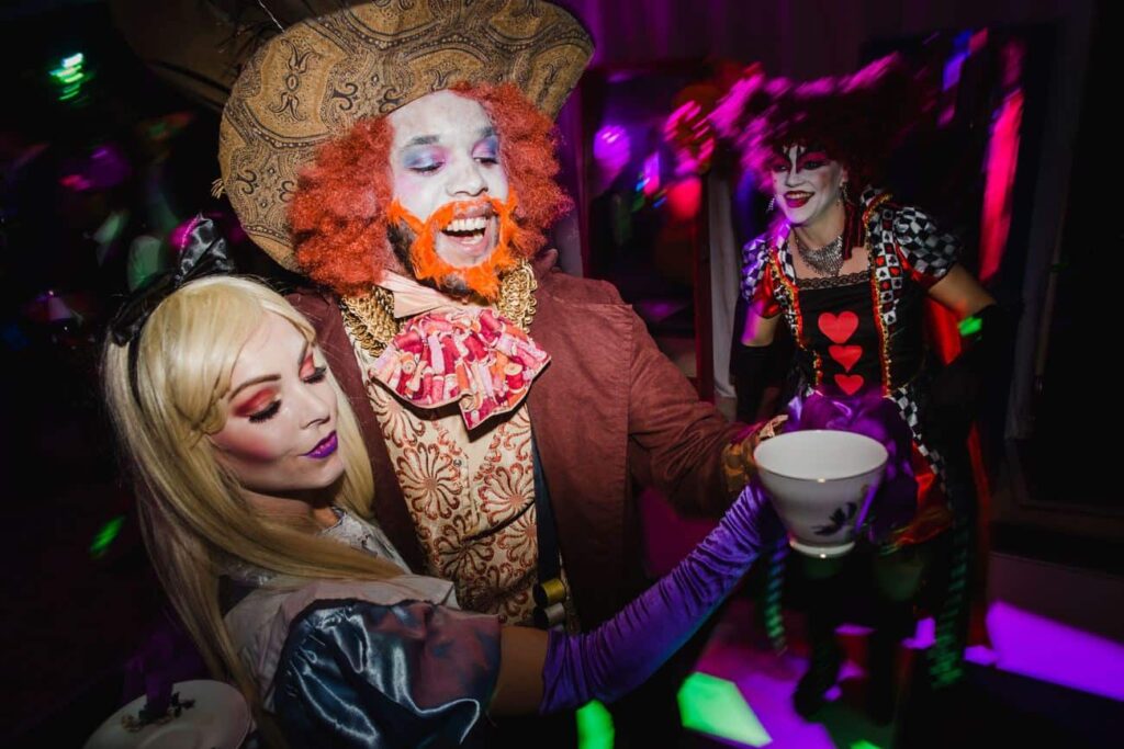Twisted Alice In Wonderland themed meet and greet entertainers - mad hatter and queen.