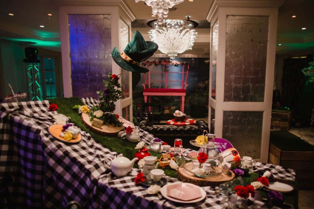 Twisted Alice In Wonderland table design made bespoke by Julia Charles Event Management.