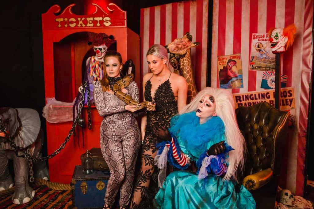 Twisted Circus Halloween Birthday Party Photo Booth being used by Erin (our client), our snake charmer and zombie drag queen.