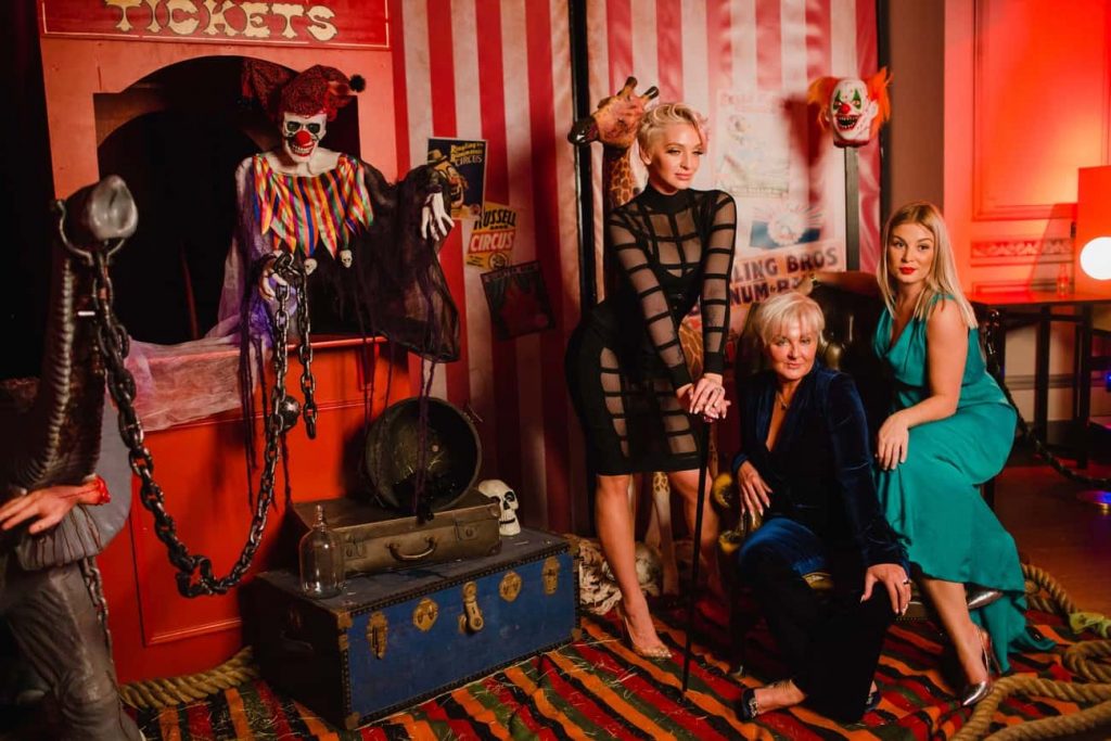 Twisted Circus Themed Halloween Event Photo Booth we created using bespoke props and decorations for guests to take photos home from the event.
