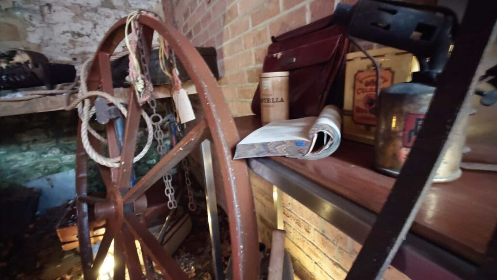 A western themed set design including wagon wheel and lanterns with lasso.