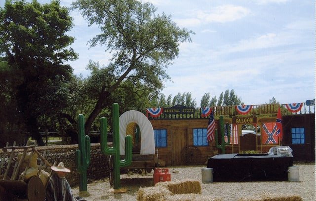 Wild West Frontier Town created with a traditional Saloon, Cacti and other bespoke props used to for a wild west themed family fun day for Amazon.