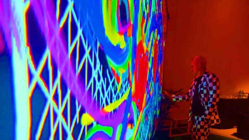 Person drawing on interactive digital wall