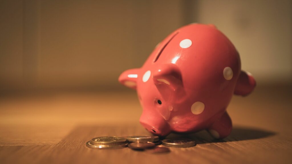 Piggy bank positioned to look at coins