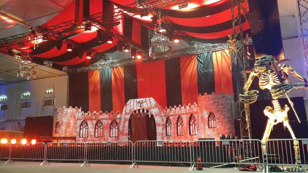 Skeleton props and immersive backdrops for horror festival 
